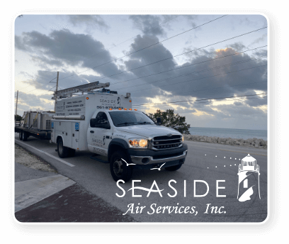 A Seaside Air Services Truck driving near the seaside.